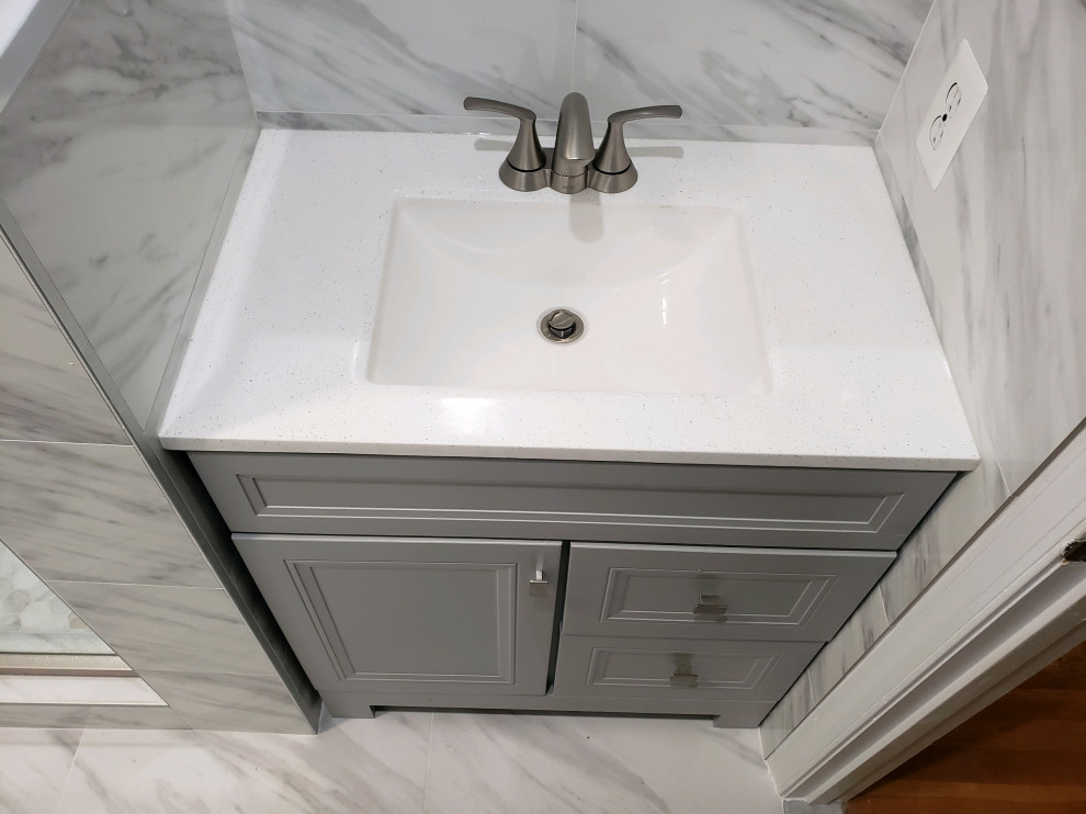 Mid-sized contemporary master bathroom in DC Metro with shaker cabinets, grey cabinets, an alcove shower, a two-piece toilet, white tile, white walls, porcelain floors, an undermount sink, quartzite benchtops, white floor, a sliding shower screen, grey benchtops, a niche, a single vanity and a built-in vanity.