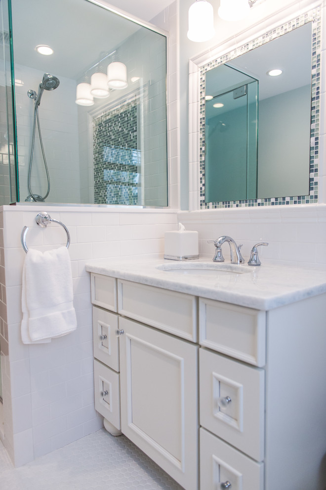 Example of a mid-sized transitional kids' white tile and subway tile porcelain tile and white floor corner shower design in New York with furniture-like cabinets, white cabinets, blue walls, an undermount sink, quartz countertops and a hinged shower door