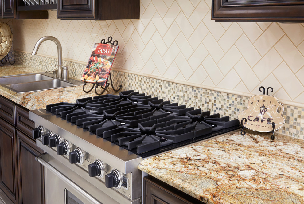 Minimalist kitchen photo in Phoenix with granite countertops, beige backsplash and subway tile backsplash