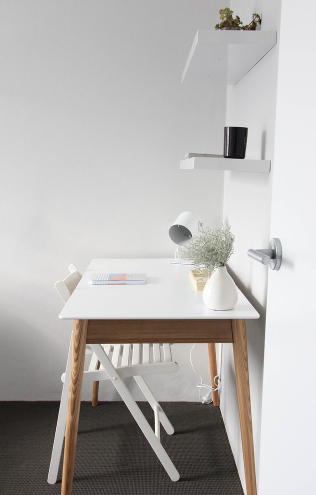 Inspiration for a small scandinavian study room in Sydney with white walls, carpet and a freestanding desk.