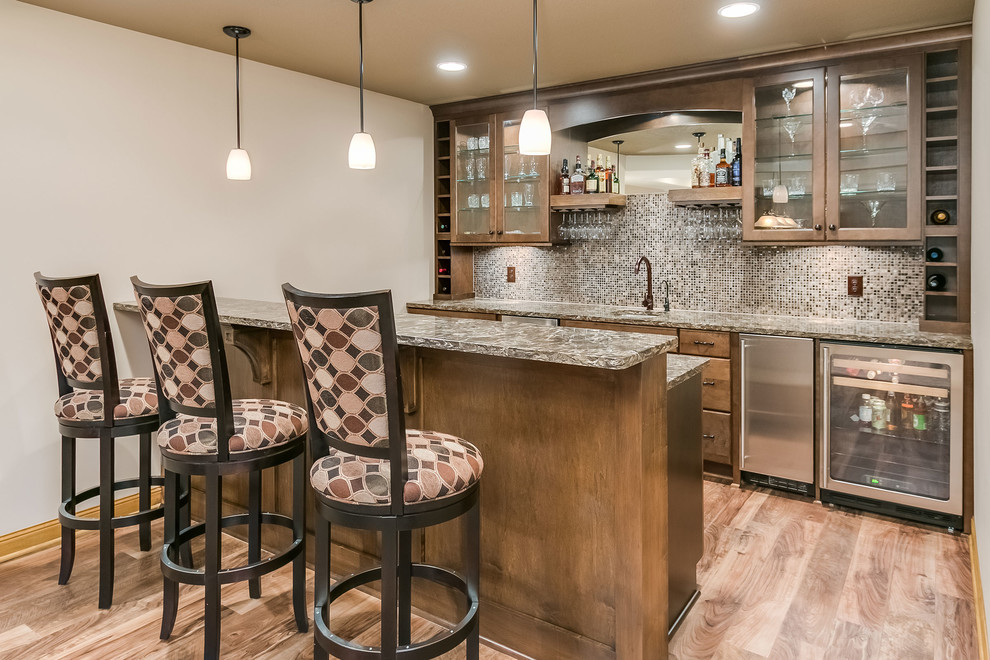 This is an example of a large transitional home bar in Minneapolis with carpet and grey floor.