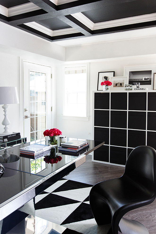 Inspiration for a contemporary freestanding desk dark wood floor study room remodel in Austin with white walls