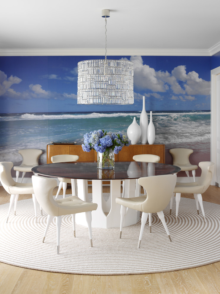 Design ideas for an eclectic dining room in New York with multi-coloured walls, light hardwood floors and beige floor.