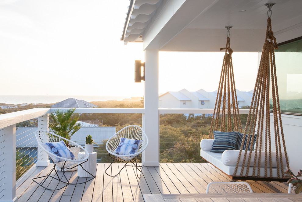Patio - mid-sized coastal backyard patio idea in Miami with a roof extension