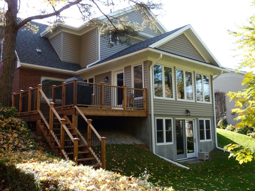 Example of a transitional home design design in Toronto