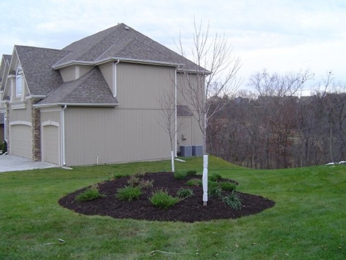 This is an example of a contemporary full sun side yard concrete paver driveway.