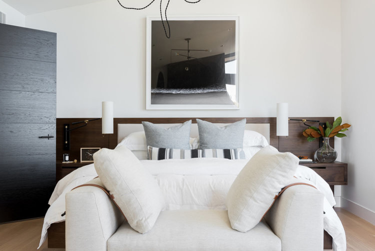 Inspiration for a large modern master bedroom in Salt Lake City with white walls and light hardwood floors.