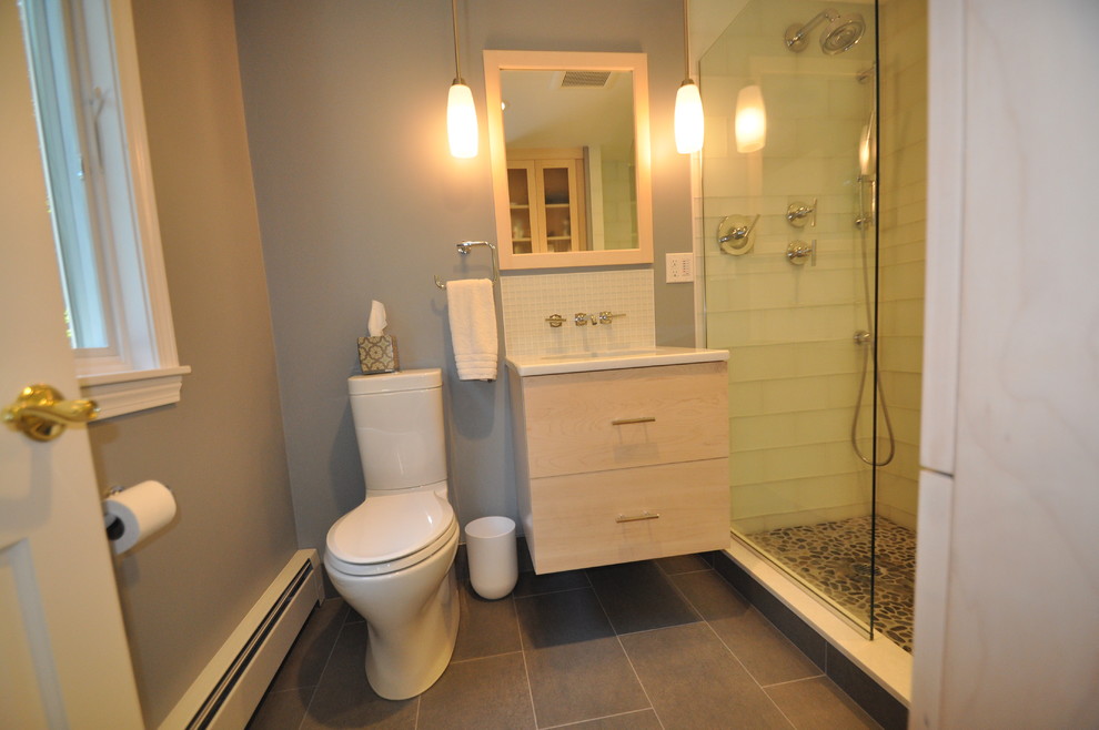 Design ideas for a mid-sized contemporary 3/4 bathroom in Boston with flat-panel cabinets, light wood cabinets, an alcove shower, a one-piece toilet, white tile, glass tile, grey walls, slate floors, an undermount sink and engineered quartz benchtops.