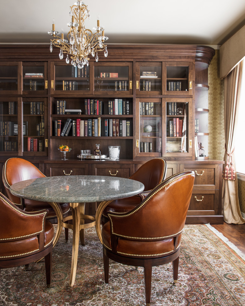 Traditional home office in San Francisco with a library, medium hardwood floors and brown floor.
