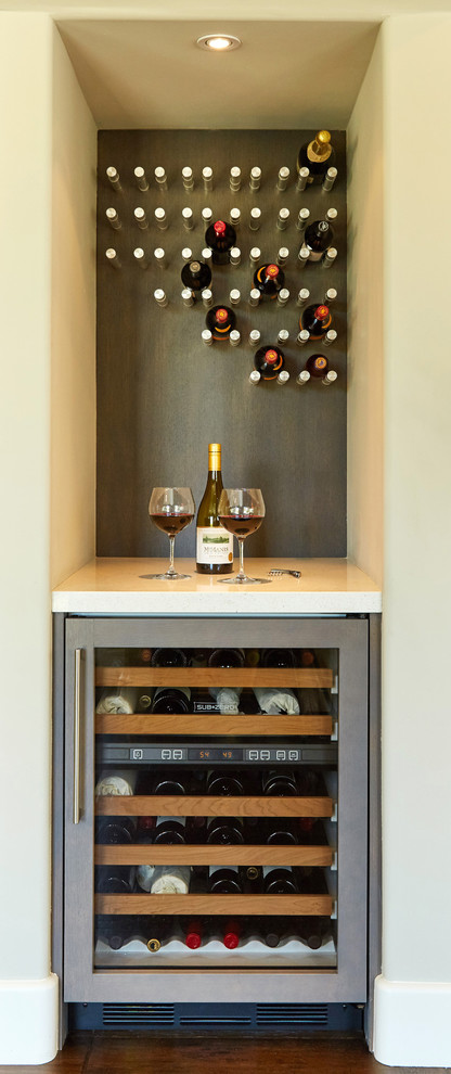 Inspiration for a mid-sized contemporary seated home bar in San Diego with an undermount sink, shaker cabinets, grey cabinets, quartz benchtops, multi-coloured splashback and dark hardwood floors.