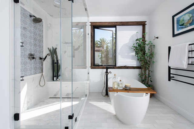 Primary Bathroom remodel featuring a steam shower and a freestanding