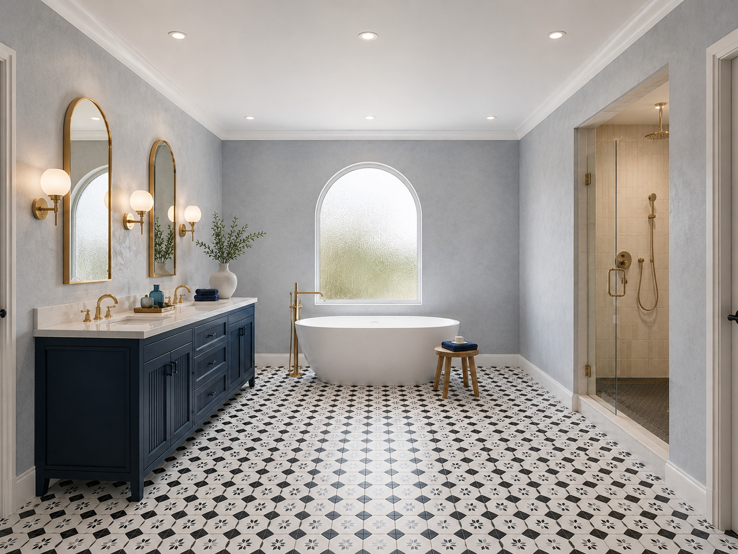 Navy vanity, arched mirrors, and tub
