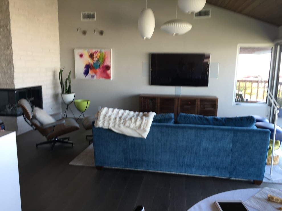 Need help with what to put on a wall next to a mounted TV