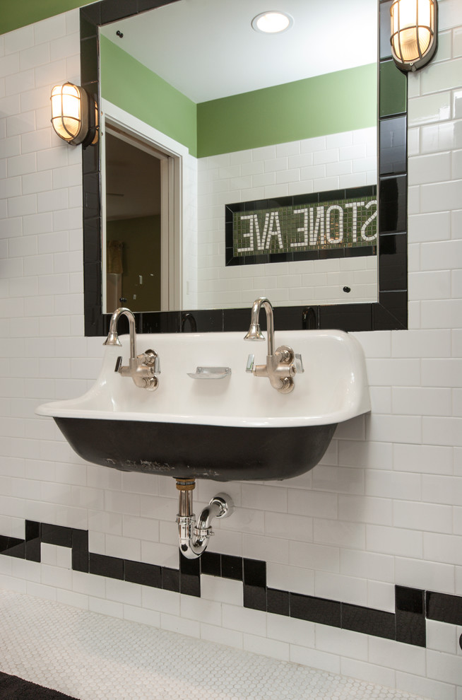 Eclectic bathroom in Chicago with a wall-mount sink.