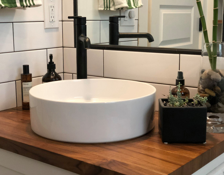 Design ideas for a small industrial bathroom in Portland with shaker cabinets, white cabinets, white tile, subway tile, white walls, wood benchtops, brown benchtops, a single vanity, a floating vanity and decorative wall panelling.