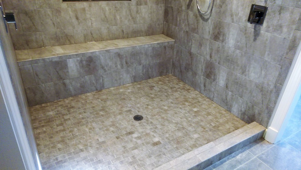 Large transitional master gray tile and porcelain tile porcelain tile and gray floor double shower photo in Baltimore with furniture-like cabinets, medium tone wood cabinets, gray walls, an undermount sink, marble countertops and a hinged shower door
