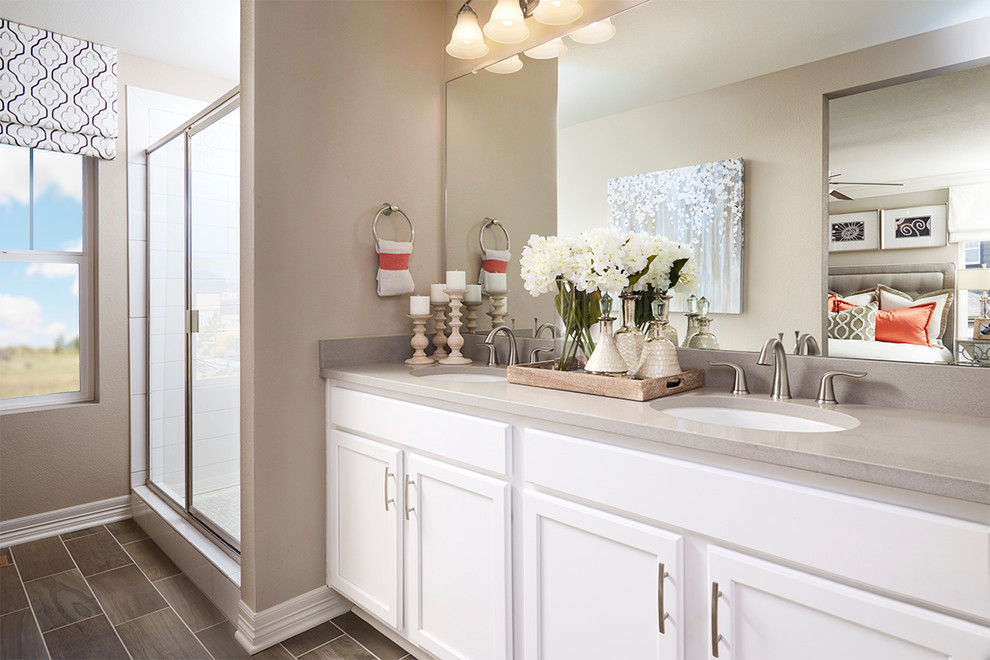 Contemporary master bathroom in Denver with white cabinets.