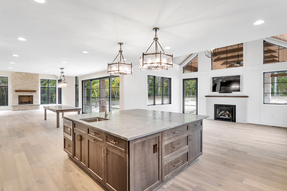 Eat-in kitchen - huge rustic l-shaped medium tone wood floor, multicolored floor and wood ceiling eat-in kitchen idea with an undermount sink, shaker cabinets, medium tone wood cabinets, soapstone countertops, gray backsplash, quartz backsplash, stainless steel appliances, an island and gray countertops