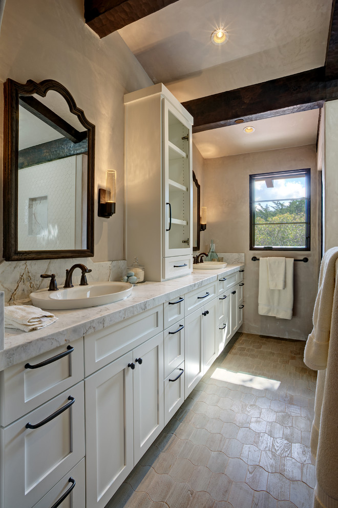 Design ideas for a mid-sized arts and crafts master bathroom in San Francisco with raised-panel cabinets, white cabinets, a drop-in tub, an open shower, a one-piece toilet, beige tile, terra-cotta tile, beige walls, terra-cotta floors, a pedestal sink, granite benchtops and beige floor.