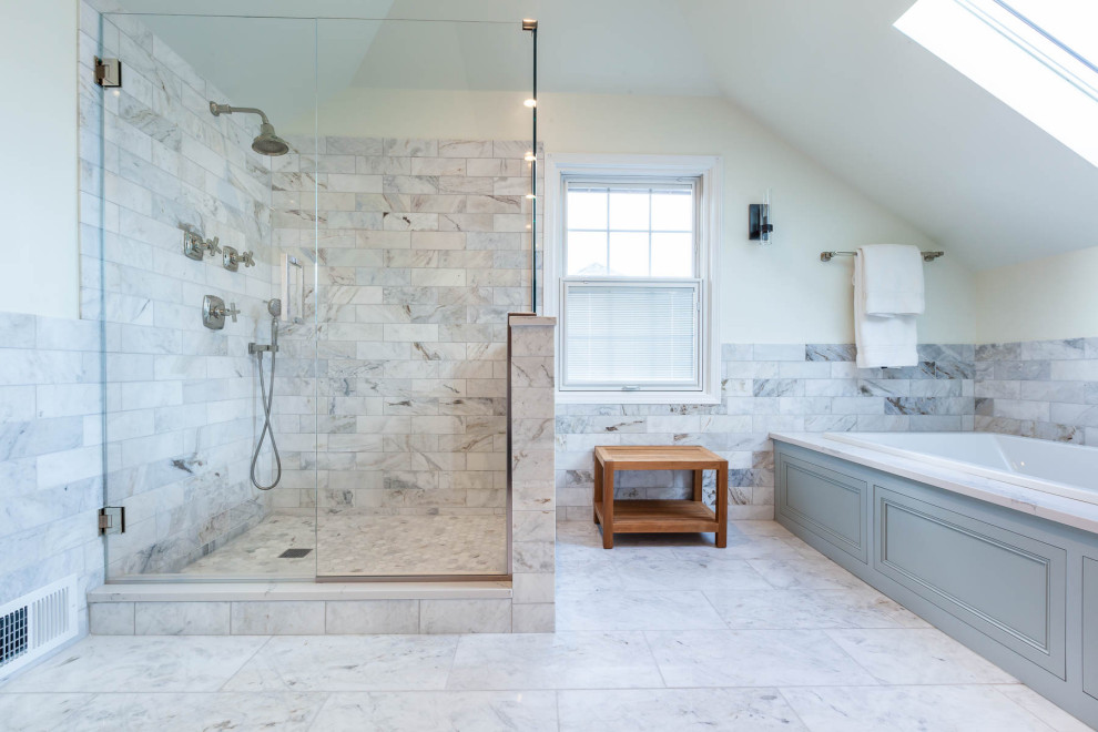 Photo of a large traditional master bathroom in Chicago with beaded inset cabinets, blue cabinets, a drop-in tub, a corner shower, a two-piece toilet, gray tile, marble, white walls, marble floors, an undermount sink, engineered quartz benchtops, grey floor, a hinged shower door, grey benchtops, a niche, a double vanity, a freestanding vanity, timber and decorative wall panelling.