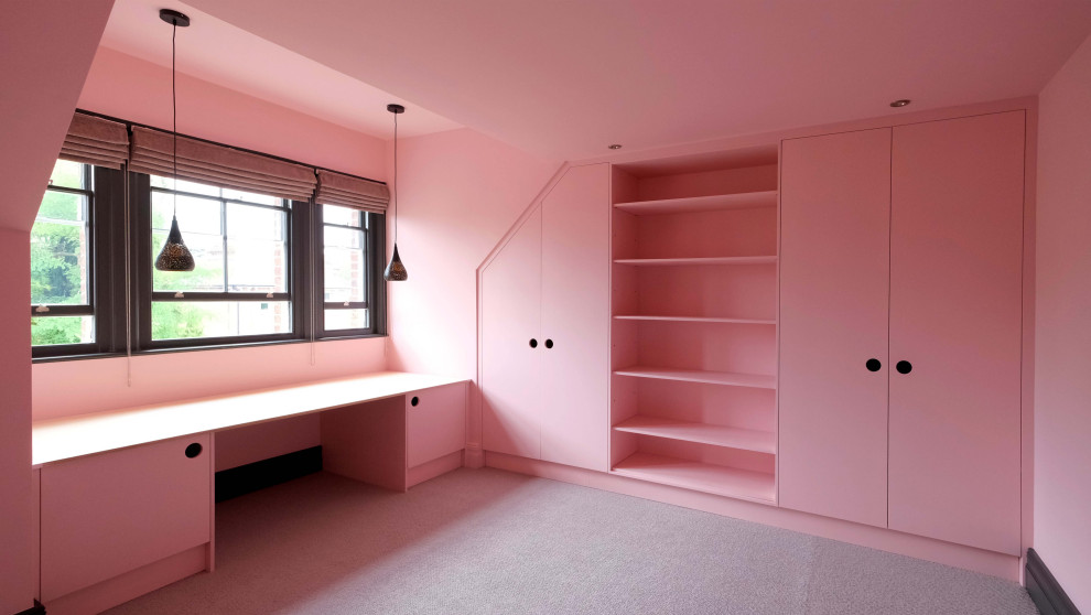 This is an example of a medium sized contemporary master and grey and pink bedroom in Kent with pink walls, carpet, no fireplace, grey floors and a feature wall.