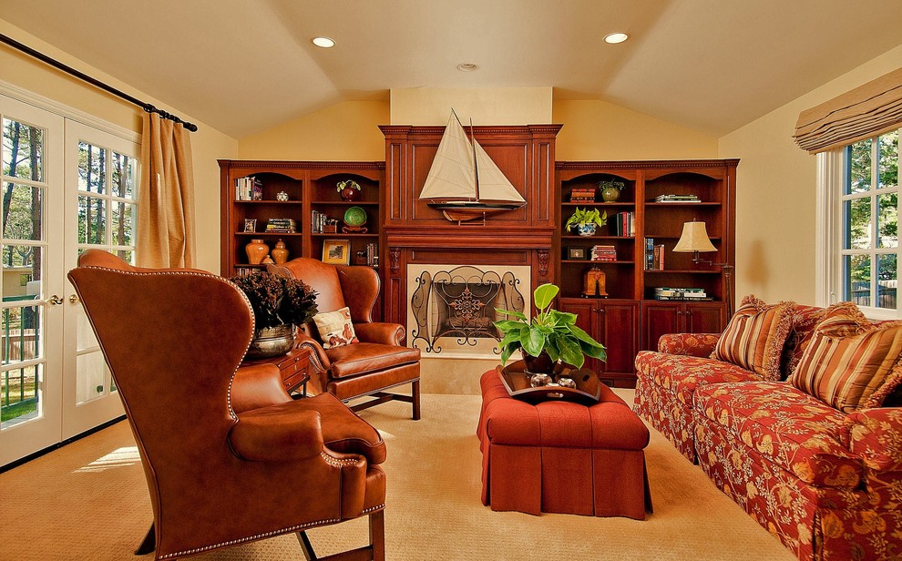 Photo of a mid-sized traditional enclosed family room in Seattle with beige walls, carpet, a standard fireplace, no tv and a wood fireplace surround.