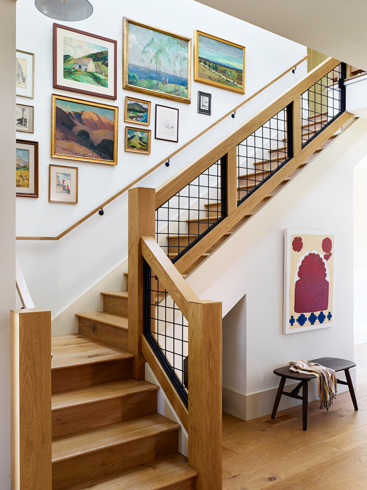 Inspiration for a large transitional wood l-shaped staircase in San Francisco with wood risers and metal railing.