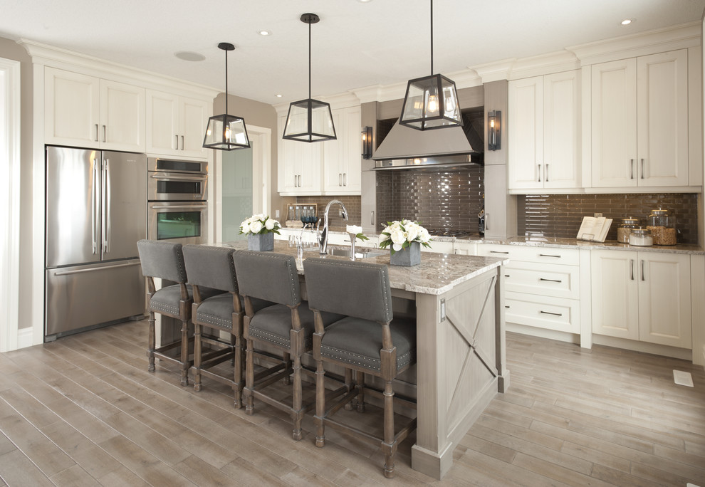 Inspiration for a transitional kitchen in Other with an undermount sink, recessed-panel cabinets, white cabinets, brown splashback, matchstick tile splashback, stainless steel appliances, light hardwood floors and with island.