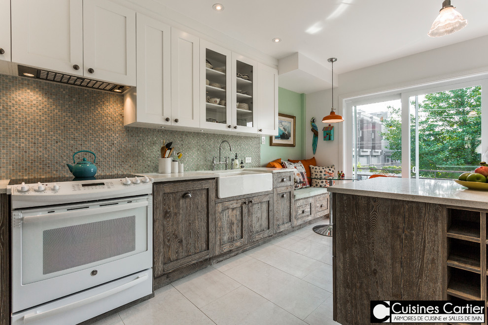Mid-sized scandinavian u-shaped separate kitchen in Montreal with a farmhouse sink, shaker cabinets, white cabinets, quartzite benchtops, blue splashback, mosaic tile splashback, white appliances, ceramic floors and with island.