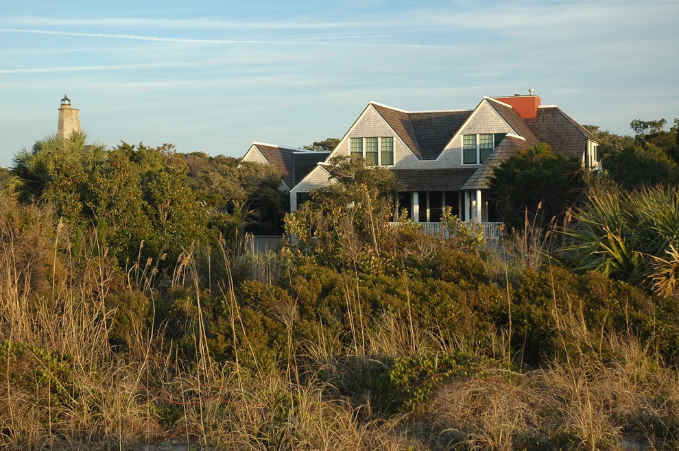 Design ideas for a beach style exterior in Wilmington with wood siding and a gable roof.