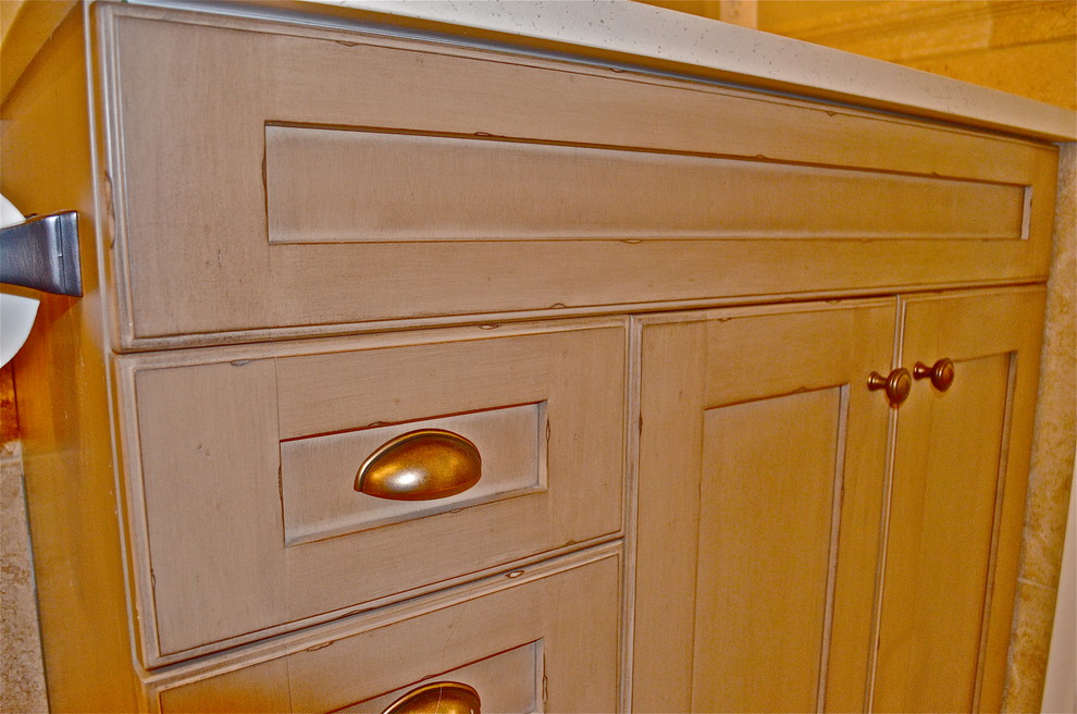 Mountain style travertine floor home design photo in Omaha with an undermount sink and solid surface countertops