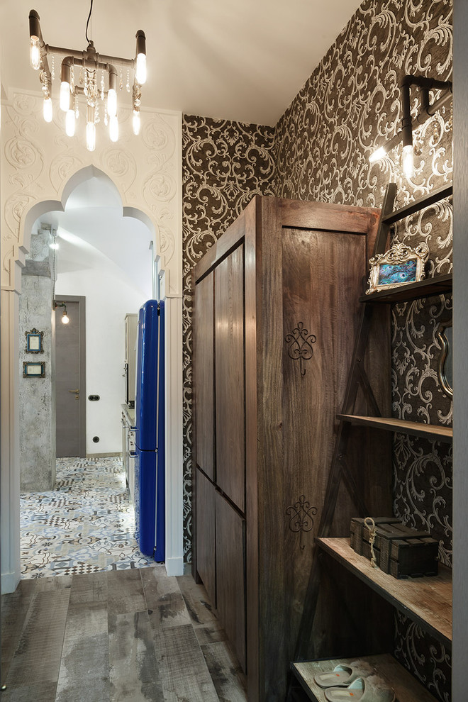 Photo of an eclectic entry hall in Saint Petersburg with porcelain floors and black walls.