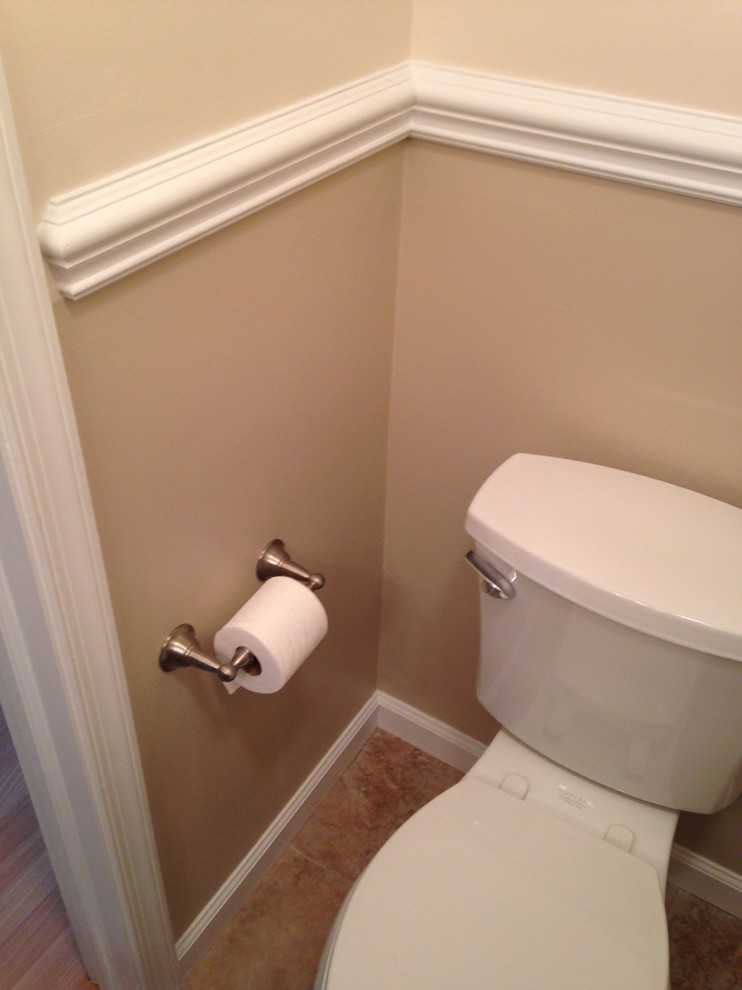 Small transitional beige tile and porcelain tile porcelain tile home design photo with an undermount sink, shaker cabinets, dark wood cabinets, granite countertops, a two-piece toilet and beige walls