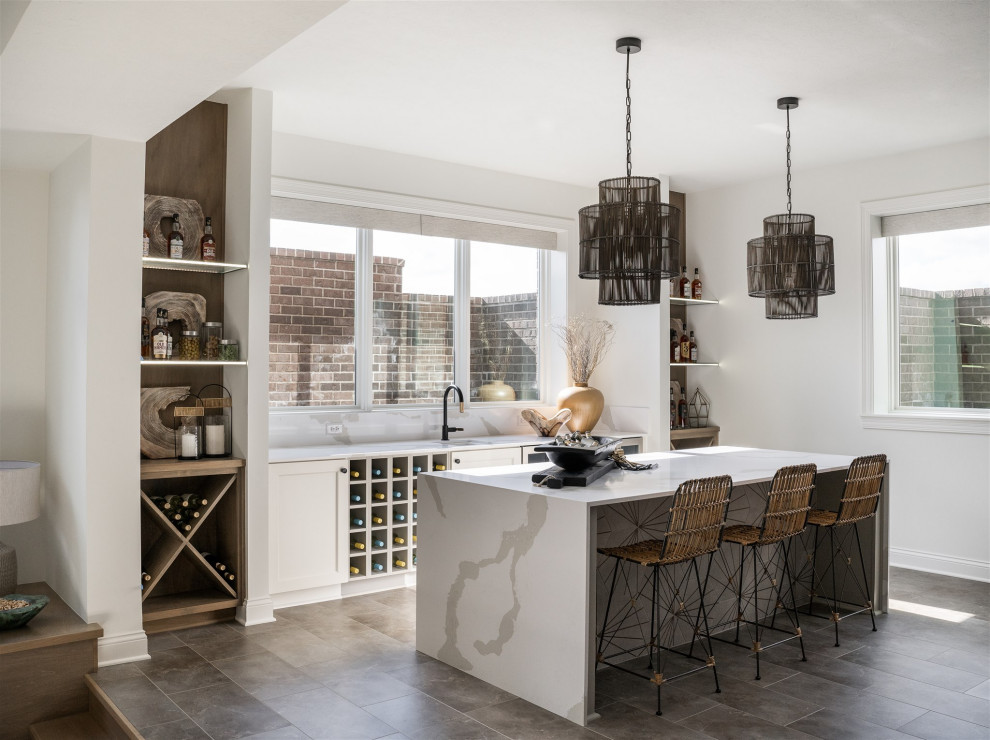 Inspiration for a mid-sized contemporary galley wet bar in Indianapolis with an undermount sink, shaker cabinets, white cabinets, quartz benchtops, white benchtop and grey floor.