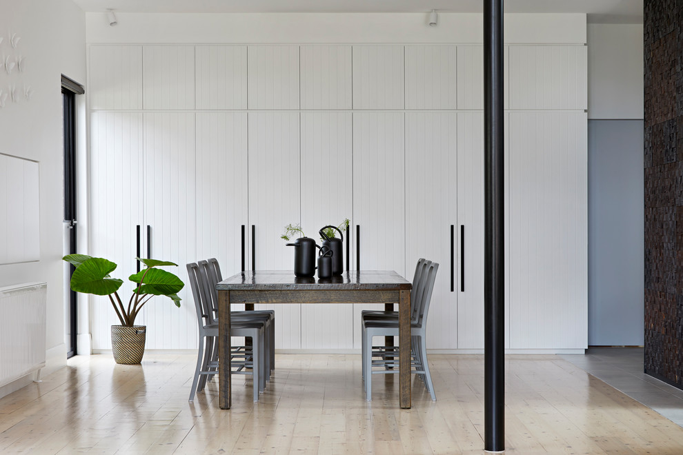 Inspiration for a mid-sized contemporary dining room in Melbourne with white walls.