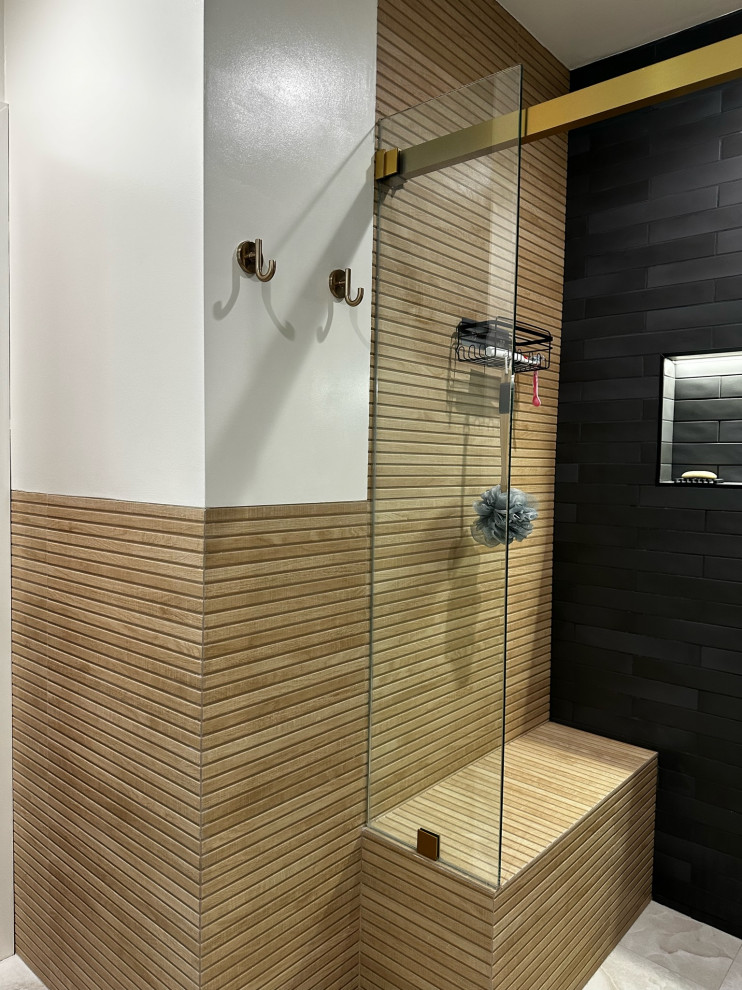 Inspiration for a large 3/4 bathroom in Los Angeles with shaker cabinets, black cabinets, a corner shower, a one-piece toilet, brown tile, wood-look tile, white walls, ceramic floors, a drop-in sink, quartzite benchtops, grey floor, a sliding shower screen, white benchtops, a double vanity and a freestanding vanity.