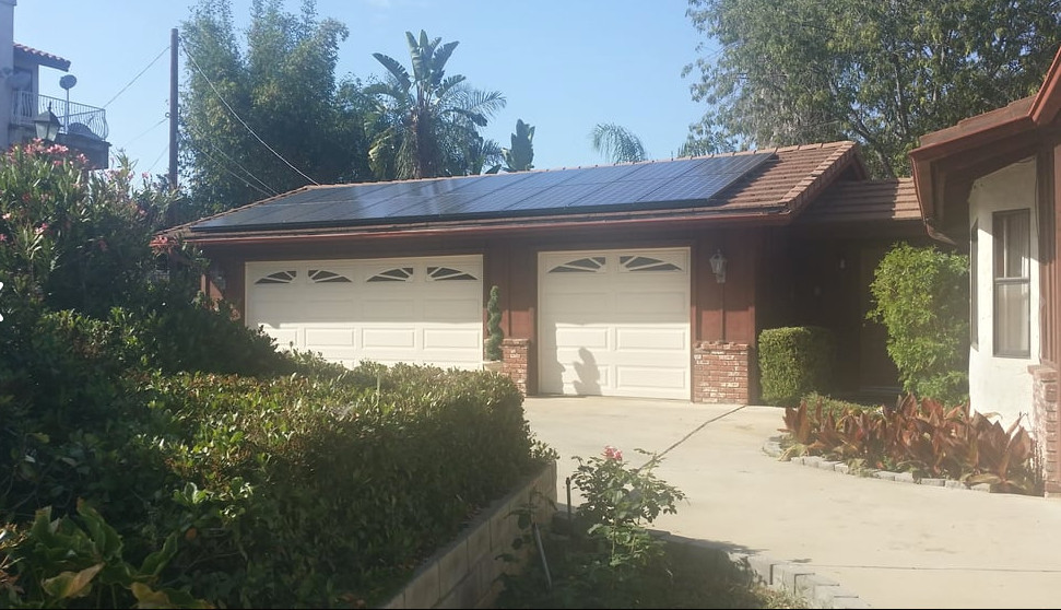 Inspiration for a mid-sized transitional brown one-story mixed siding gable roof remodel in Austin with a shingle roof