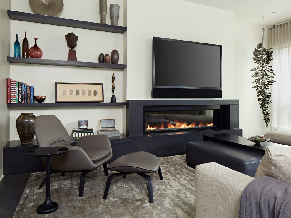 Inspiration for a contemporary living room in Chicago with white walls, dark hardwood floors, a ribbon fireplace and a wall-mounted tv.