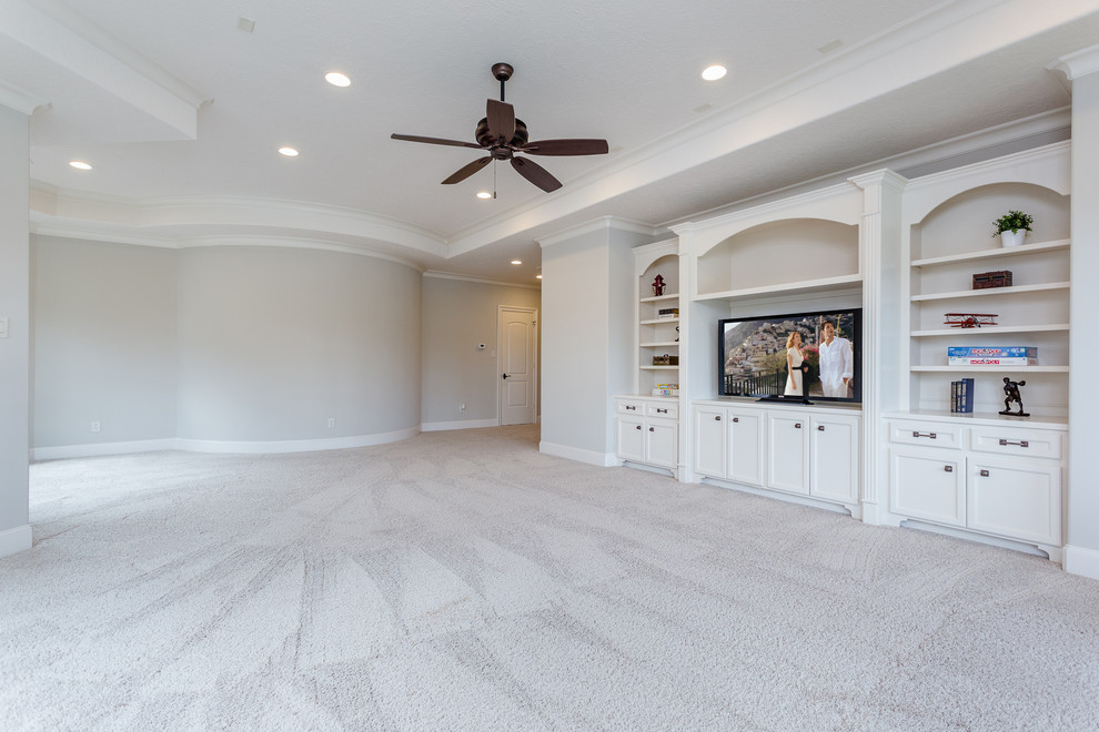 Design ideas for a large mediterranean enclosed family room in Houston with a game room, grey walls, carpet, a built-in media wall and grey floor.