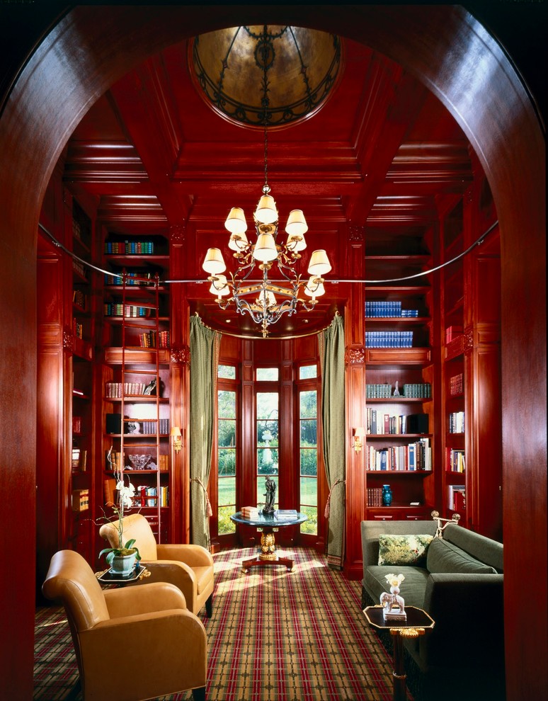 Design ideas for a traditional family room in Los Angeles with a library and carpet.