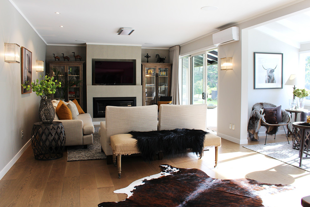 Photo of a large transitional living room in Auckland.