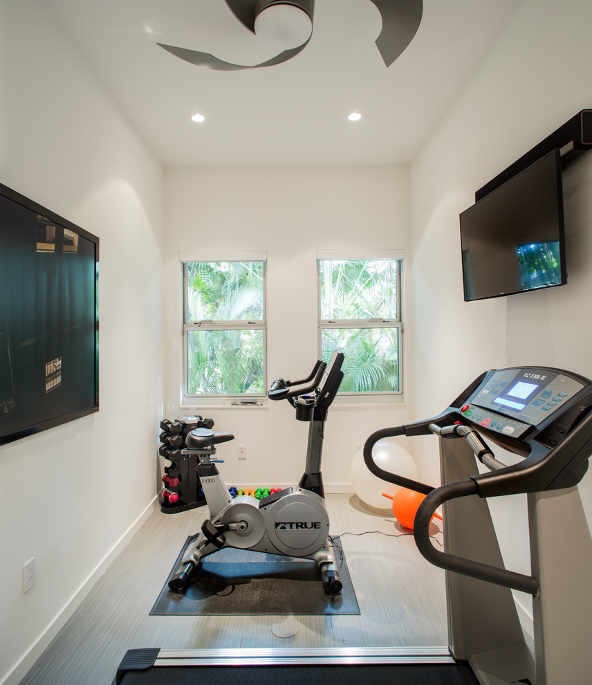 Inspiration for a small multipurpose gym in Tampa with white walls, vinyl floors and grey floor.