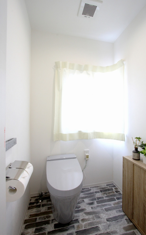 This is an example of a mid-sized modern powder room in Other with a one-piece toilet, white walls, grey floor, wallpaper and wallpaper.