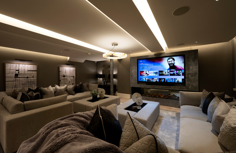 Photo of a large contemporary home cinema in Manchester with carpet, a built-in media unit and a feature wall.