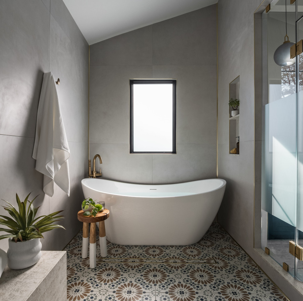 Bathroom - large transitional master gray tile and porcelain tile porcelain tile, vaulted ceiling and multicolored floor bathroom idea in DC Metro with a hinged shower door