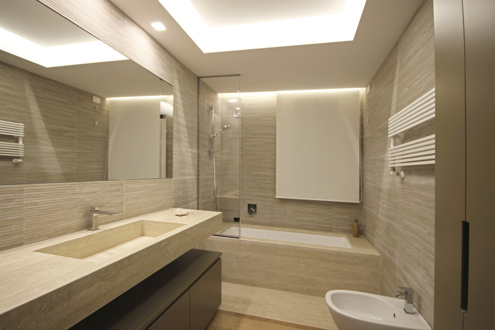 Design ideas for a mid-sized modern 3/4 bathroom in Milan with flat-panel cabinets, light wood cabinets, a curbless shower, a wall-mount toilet, beige tile, porcelain tile, beige walls, medium hardwood floors, an integrated sink, marble benchtops, beige floor, an open shower and pink benchtops.