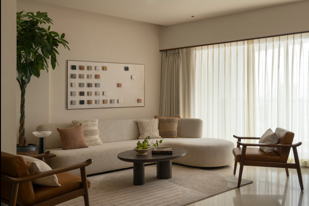 Photo of a modern living room in Mumbai With Beige Walls.