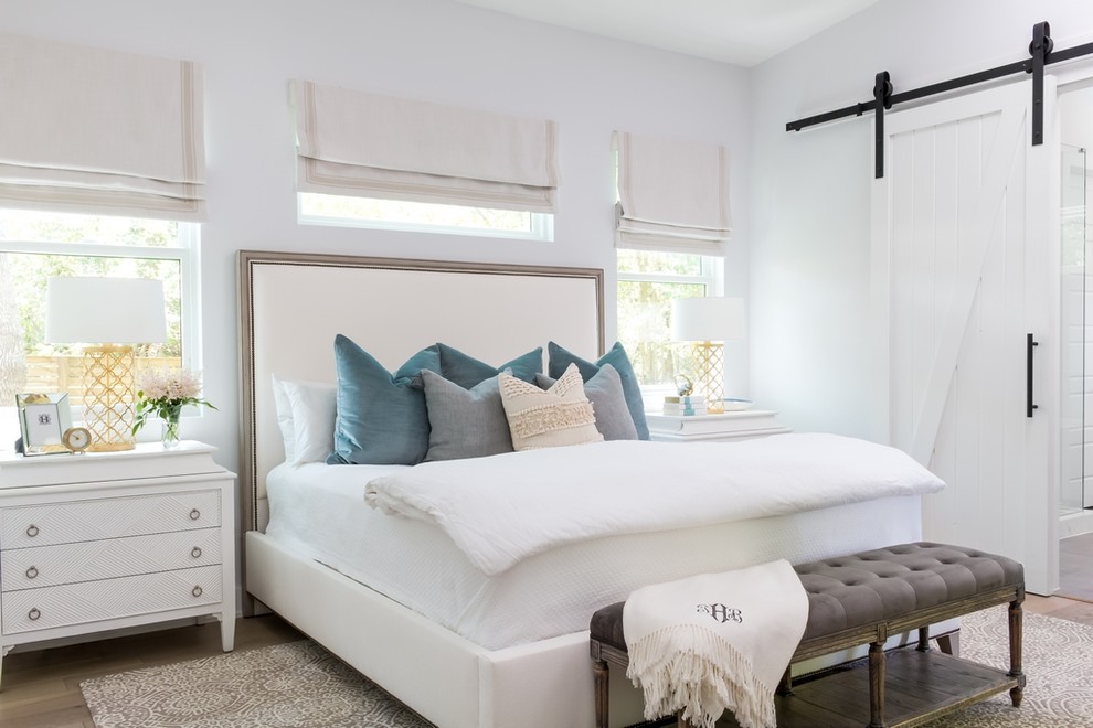 Design ideas for a country master bedroom in Austin with white walls and no fireplace.