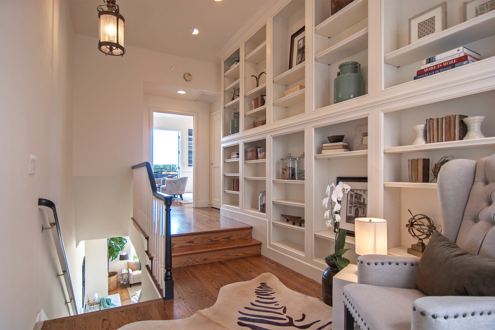Transitional hallway in San Francisco with white walls and medium hardwood floors.