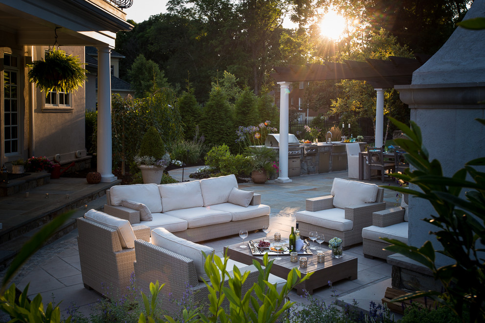 Inspiration for a transitional backyard verandah in DC Metro with an outdoor kitchen and a pergola.